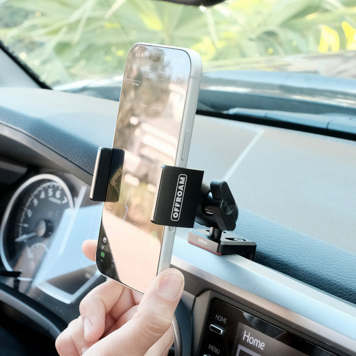 Image of Offroam Phone Mount installed securely in Toyota Tacoma 2016-2023. This premium phone mount installs easily without drilling or glue. Spring loaded Universal holder for use with any phone. Perfect placement without blocking screens, driver view, or air flow. Fully adjustable positioning.