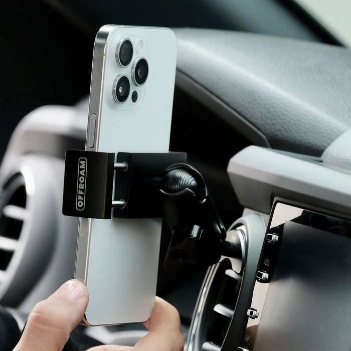 Offroam phone mount securely installed in 2016-2023 Toyota Tacoma or 2014-2021 Toyota Tundra. Vehicle-specific mounting base with 20mm ball coupled to a a double socket arm and a universal holder.