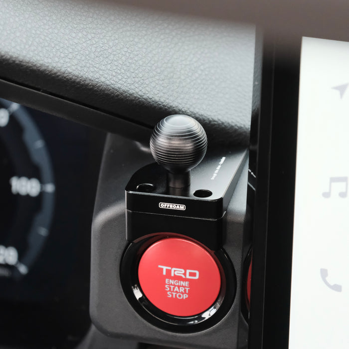 Image of Offroam Mounting Base installed securely in Toyota Tacoma 2024-2026 | 4Runner 2025-2026. This premium all metal phone mounting base installs easily without drilling or glue. Perfect placement without blocking screens, driver view, or air flow.