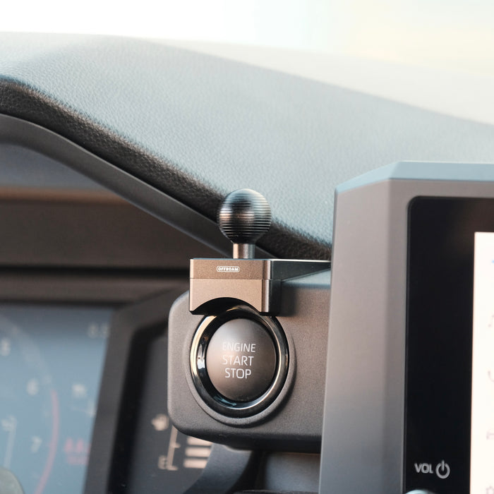 Image of Offroam Mounting Base installed securely in Toyota Tacoma 2024-2026 | 4Runner 2025-2026. This premium all metal phone mounting base installs easily without drilling or glue. Perfect placement without blocking screens, driver view, or air flow.