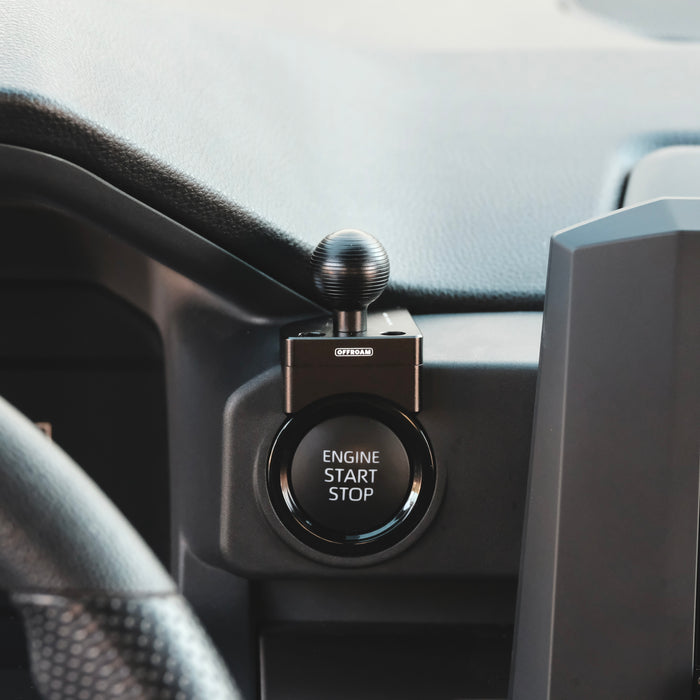 Image of Offroam Mounting Base installed securely in Toyota Tacoma 2024-2026 | 4Runner 2025-2026. This premium all metal phone mounting base installs easily without drilling or glue. Perfect placement without blocking screens, driver view, or air flow.