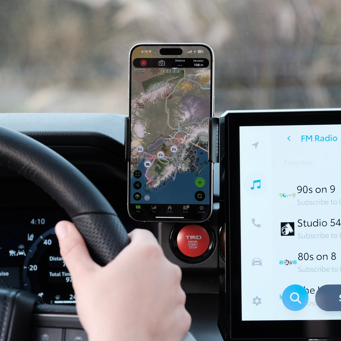 Image of Offroam Phone Mount installed securely in Toyota Tacoma 2024-2026 | 4Runner 2025-2026. This premium phone mount installs easily without drilling or glue. Spring loaded Universal holder for use with any phone. Perfect placement without blocking screens, driver view, or air flow. Fully adjustable positioning.