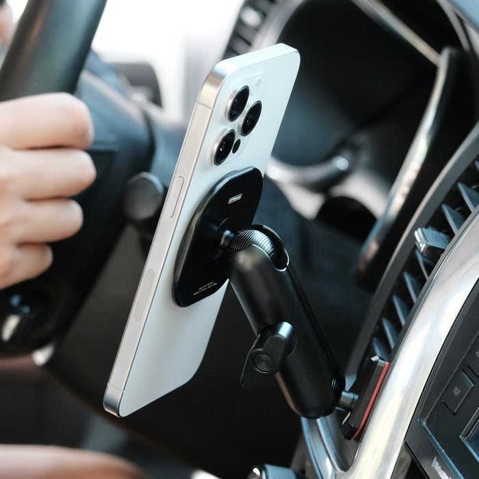 Image of Offroam MagSafe-compatible Phone Mount installed securely in Toyota Tundra 2007-2013 | Sequoia 2008-2022. This premium phone mount installs easily without drilling or glue. High force magnets hold phone on any trail, road, or track. Perfect placement without blocking screens, driver view, or air flow. Fully adjustable positioning.
