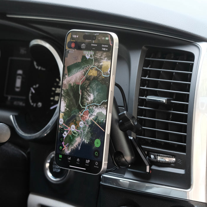 Image of Offroam MagSafe-compatible Phone Mount installed securely in Toyota Tundra 2007-2013 | Sequoia 2008-2022. This premium phone mount installs easily without drilling or glue. High force magnets hold phone on any trail, road, or track. Perfect placement without blocking screens, driver view, or air flow. Fully adjustable positioning.