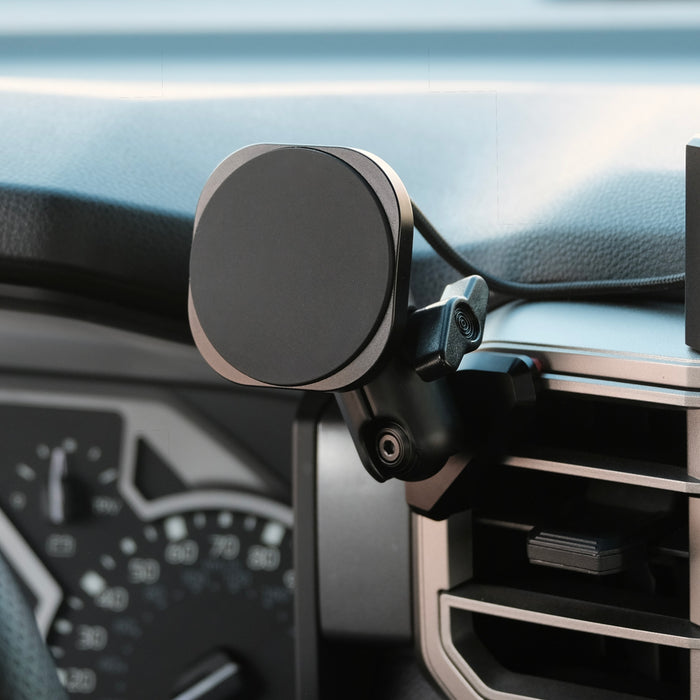 Image of Offroam MagSafe-compatible Phone Mount installed securely in Toyota Tundra 2022-2026 | Sequoia 2023-2026. This premium phone mount installs easily without drilling or glue. High force magnets hold phone on any trail, road, or track. Perfect placement without blocking screens, driver view, or air flow. Fully adjustable positioning.