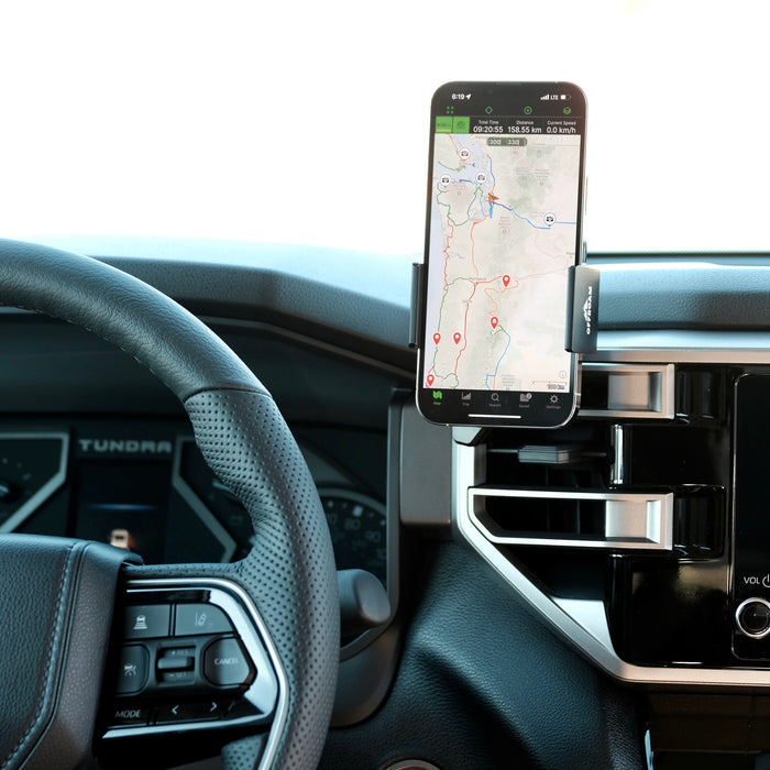 Image of Offroam Phone Mount installed securely in Toyota Tundra 2022-2026 | Sequoia 2023-2026. This premium phone mount installs easily without drilling or glue. Spring loaded Universal holder for use with any phone. Perfect placement without blocking screens, driver view, or air flow. Fully adjustable positioning.