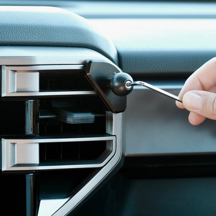 Image of Offroam Mounting Base installed securely in Toyota Tundra 2022-2026 | Sequoia 2023-2026. This premium all metal phone mounting base installs easily without drilling or glue. Perfect placement without blocking screens, driver view, or air flow.