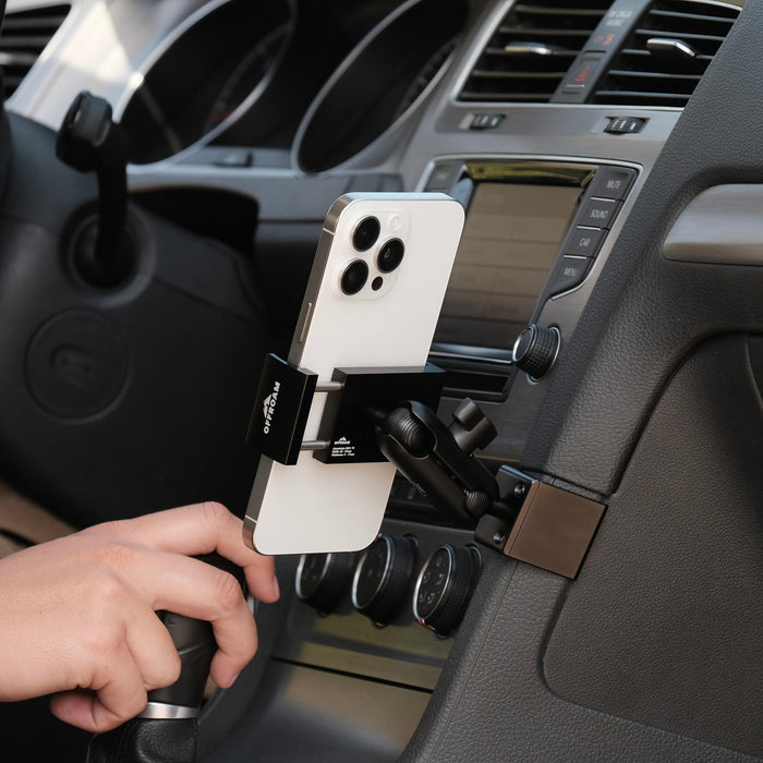 Image of Offroam Phone Mount installed securely in Volkswagen Golf 2015-2021. This premium phone mount installs easily without drilling or glue. Spring loaded Universal holder for use with any phone. Perfect placement without blocking screens, driver view, or air flow. Fully adjustable positioning.