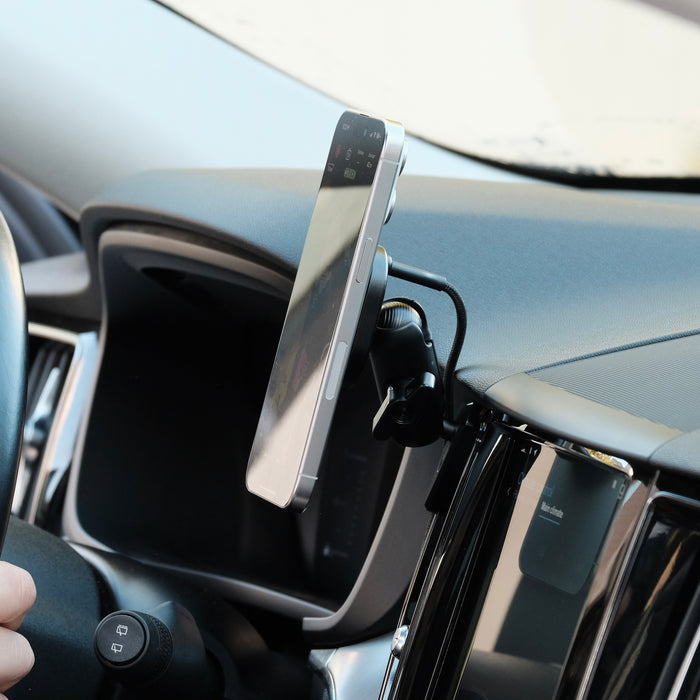 Offroam phone mount installed on Volvo XC60 2018-2026 models with Qi2 charging holder. Shown holding iPhone securely with MagSafe magnets and articulating arm.