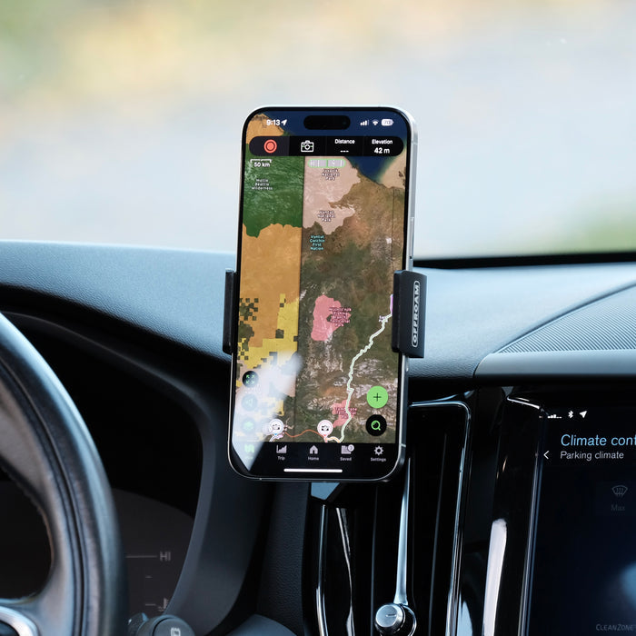 Offroam universal phone mont installed on  Volvo XC60 2018-2026 in perfect spot without blocking the view of thread. Does not block air flow and holds securely without glue or drilling. Shown holding iPhone securely.