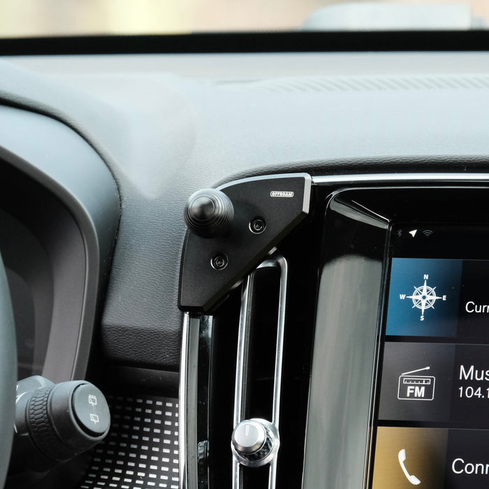 Image of Offroam Mounting Base installed securely in Volvo XC40 2018-2026. This premium all metal phone mounting base installs easily without drilling or glue. Perfect placement without blocking screens, driver view, or air flow.