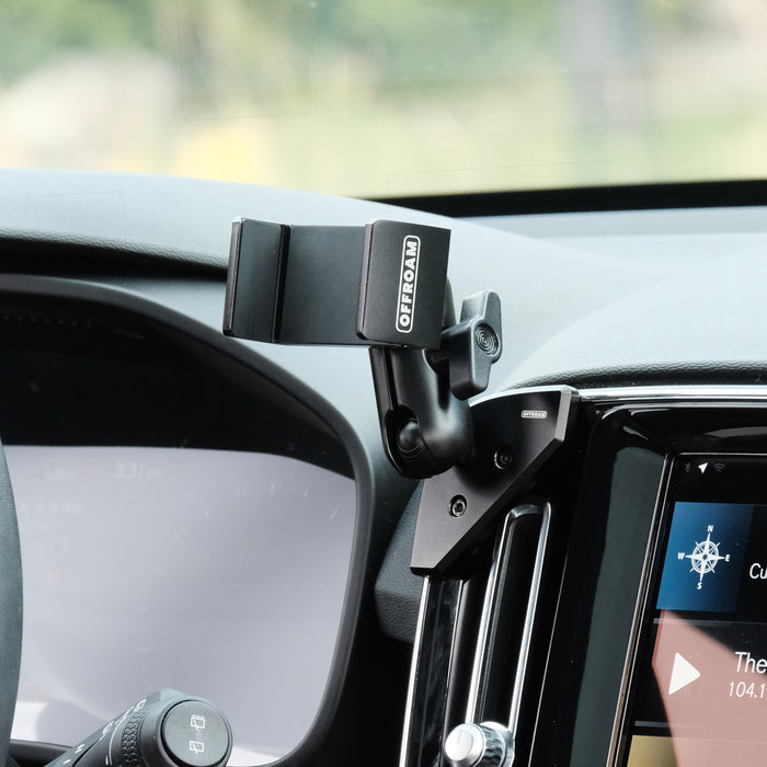 Image of Offroam Phone Mount installed securely in Volvo XC40 2018-2026. This premium phone mount installs easily without drilling or glue. Spring loaded Universal holder for use with any phone. Perfect placement without blocking screens, driver view, or air flow. Fully adjustable positioning.