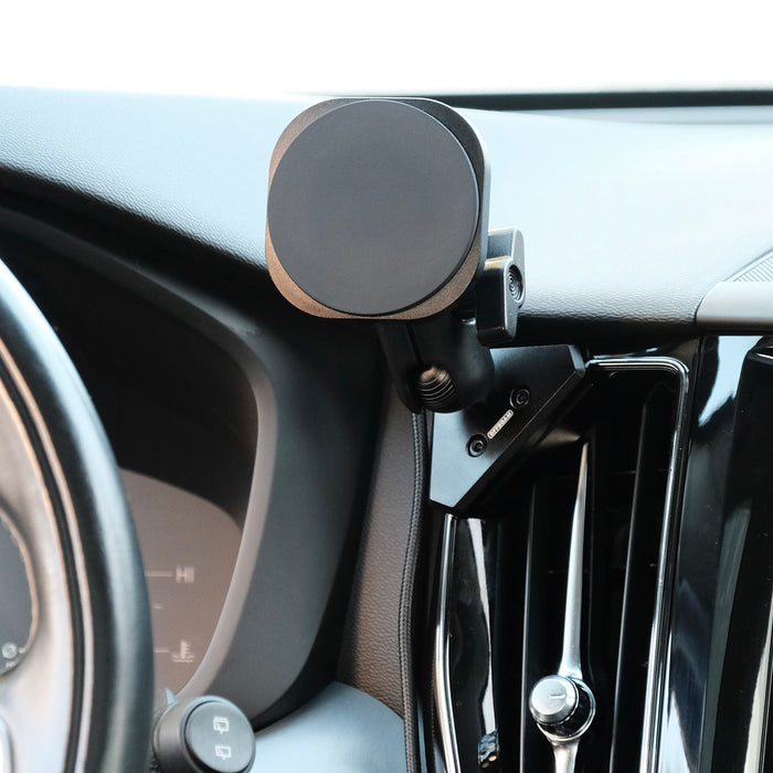 Offroam phone mount attached to the dashboard of Volvo XC60 securely. Featuring a Qi2 charging holder with powerful magnets for secure hold