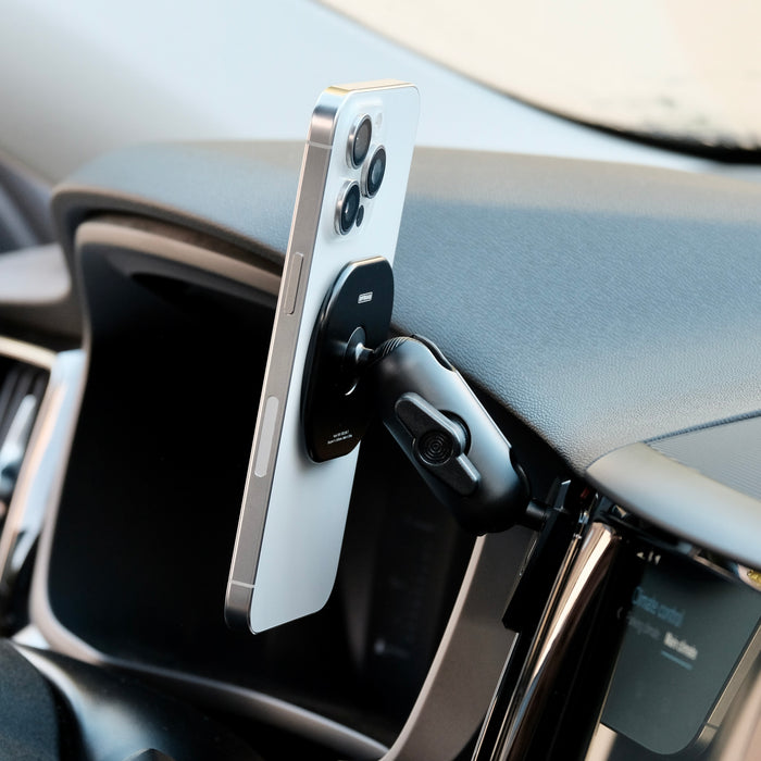 Offroam non-charging magsafe phone mount installed on Volvo XC60 2018-2026 models. Shown holding iPhone securely with MagSafe magnets and articulating arm.