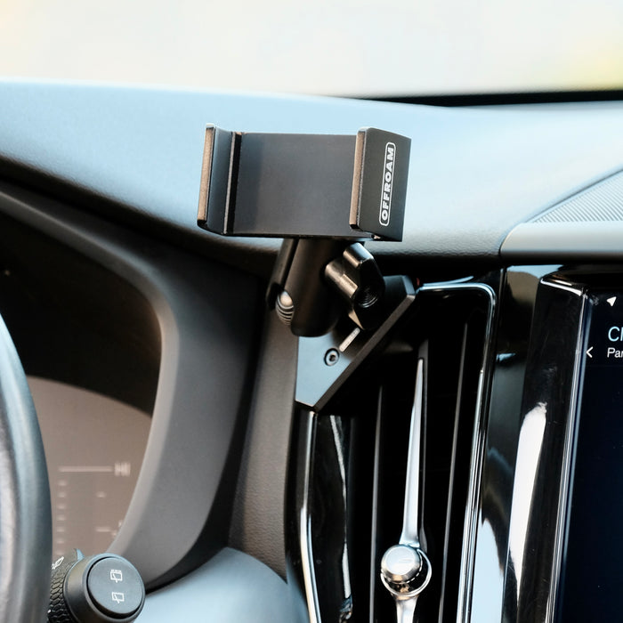 Offroam universal phone mont installed on  Volvo XC60 2018-2026. Does not block air flow and holds securely without glue or drilling. Secure mechanical holder for one-hand use and off-roading.