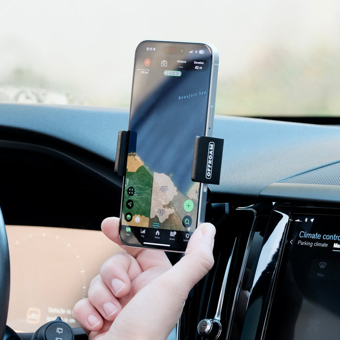 Offroam universal phone mont installed on  Volvo XC60 2018-2026. Does not block air flow and holds securely without glue or drilling. Secure mechanical holder for one-hand use and off-roading.